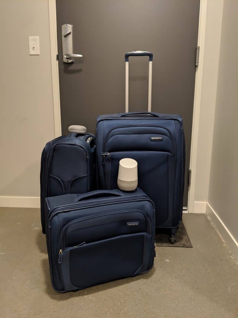 Google home on top of suit cases.