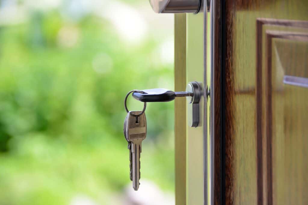 A key inside a lock of a door.