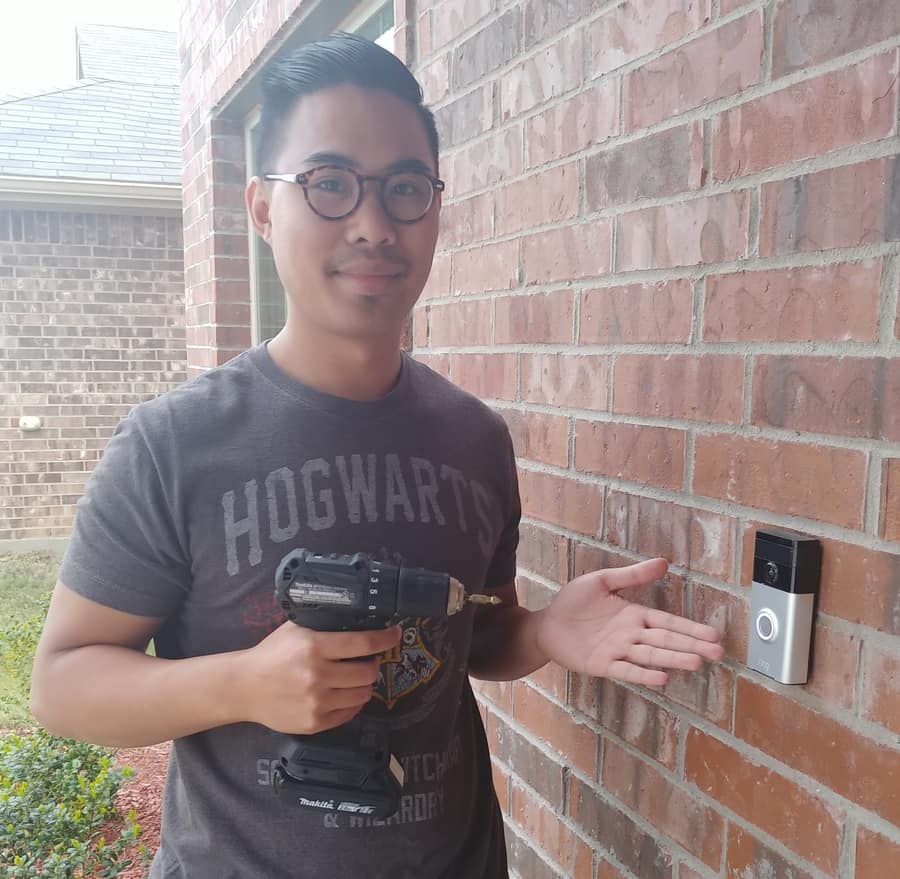 Man installing a ring doorbell