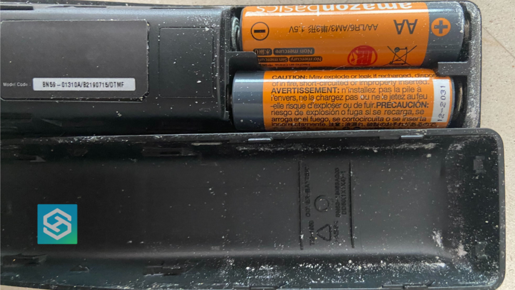 A Samsung remote with some light battery corrosion