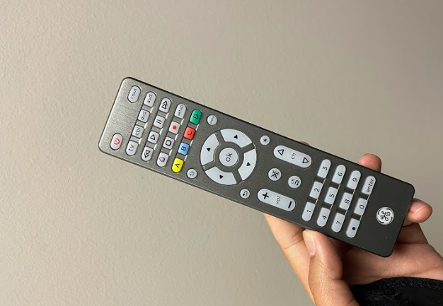 Hand holding GE Universal TV Remote