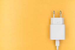 white power cord on yellow background