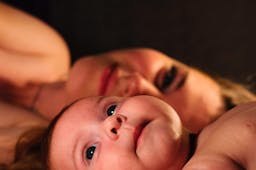 Mama and baby on a dark background