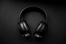 black headphones on black background