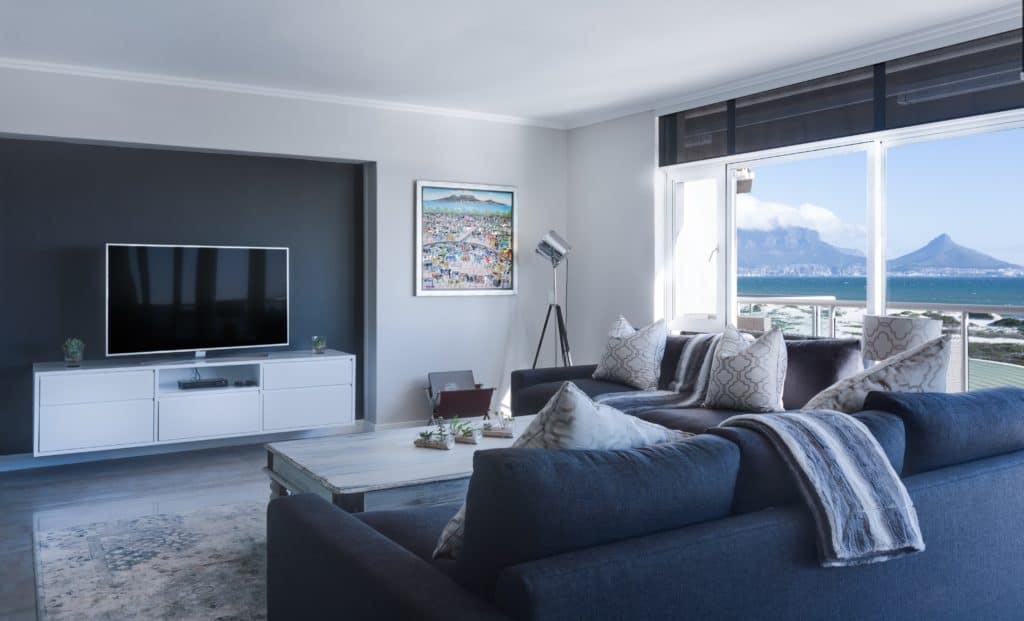 Modern living room with mountains in the backyard.