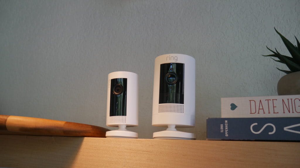 Two ring cameras on a shelf