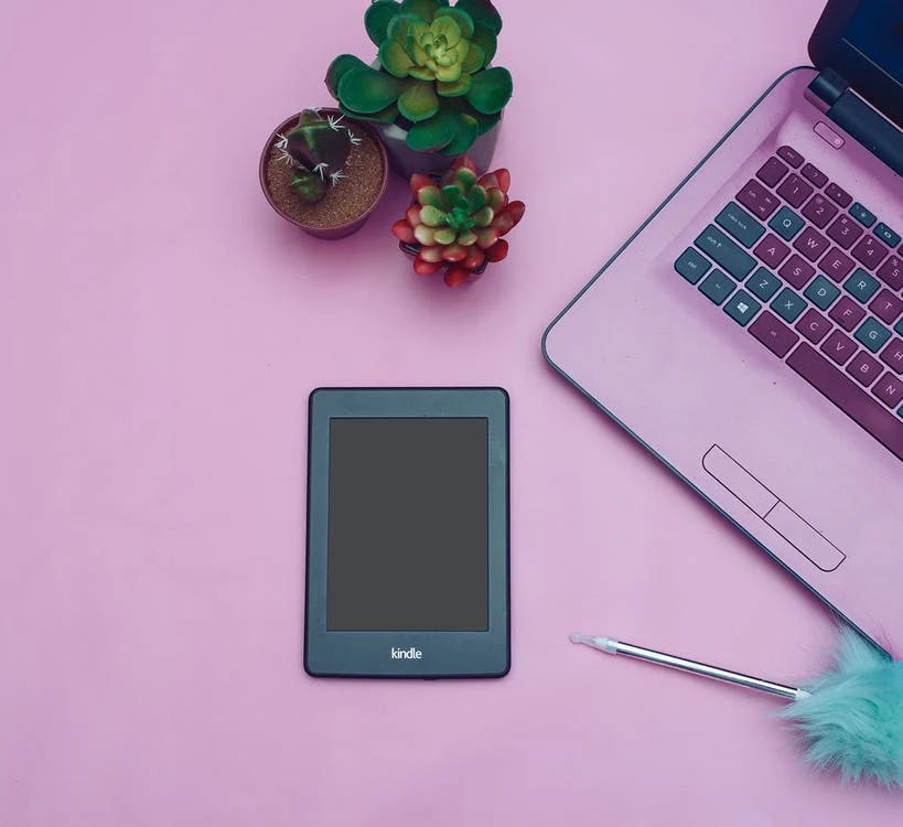 Kindle next to a computer